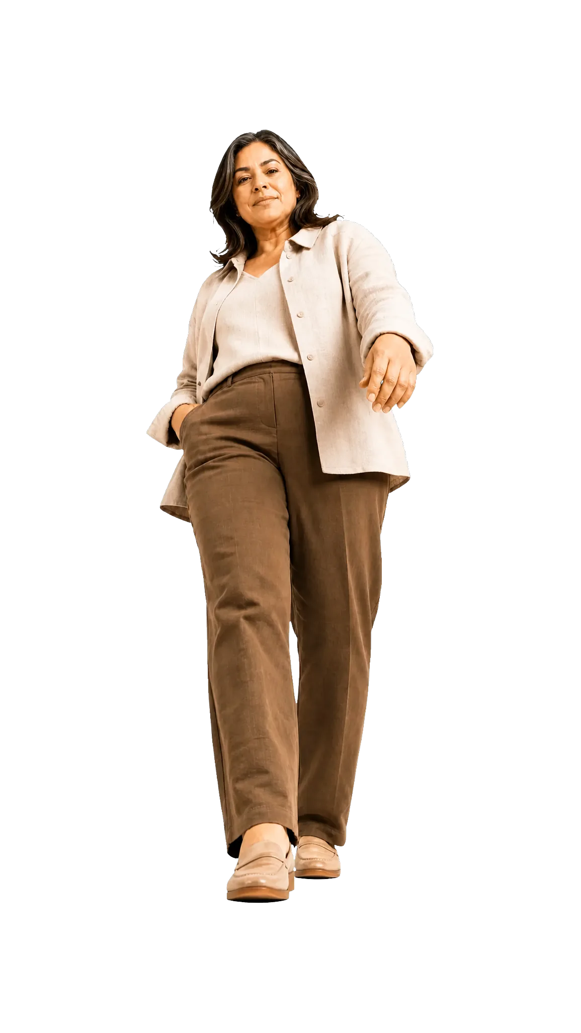 A woman standing confidently in warm neutral clothing